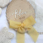 Personalised Baby Name Reveal Wooden Scallop Bow Plaque