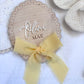 Personalised Baby Name Reveal Wooden Scallop Bow Plaque